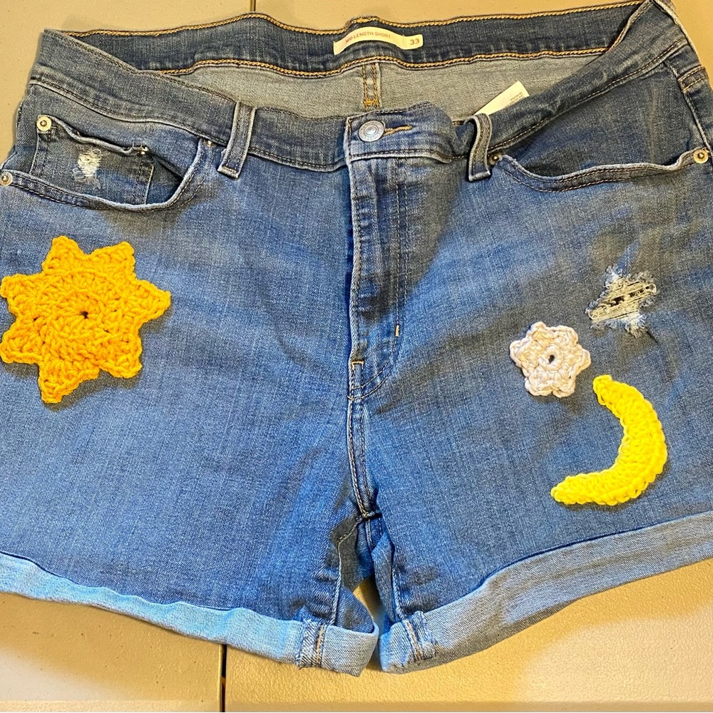 Levi’s upcycled cutoffs. Hand crocheted & sewn appliqués. Women’s size 33